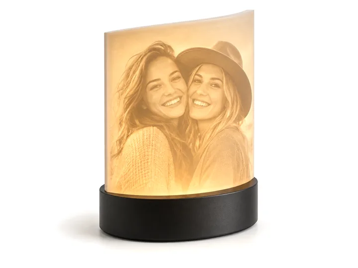 Lithophane lamp glowing with a photo of two friends